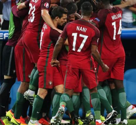 The Portugal players celebrate Renato Sanches equaliser against Poland in their Euro 2016 quarter-final last night. Picture: Alexander Demianchuk\TASS via Getty