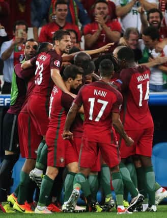 The Portugal players celebrate Renato Sanches equaliser against Poland in their Euro 2016 quarter-final last night. Picture: Alexander Demianchuk\TASS via Getty
