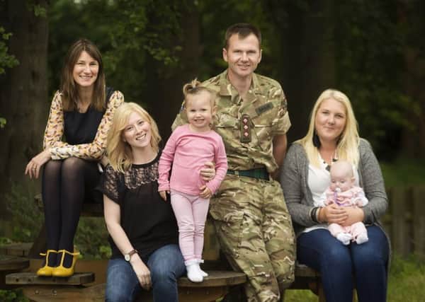 From left: WES chief operating officer Carolyn Currie, Aimee King and her daughter Sophia, unit welfare officer Scott Shaw and Sam Craig with Aimee's daughter Emily. Aimee and Sam plan to start their own business, running the cafe at Scots Corner Community Centre. Picture: Malcolm Cochrane