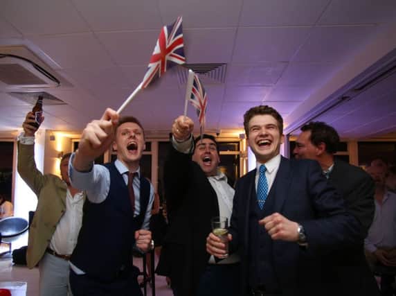 EU supporters wave Union flags and cheer as the results come in at the Leave. (Picture: should read Geoff Caddick/AFP/Getty Images)