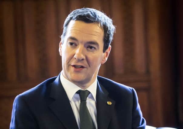 George Osborne, left, said government had to provide fiscal credibility. Picture: PA
