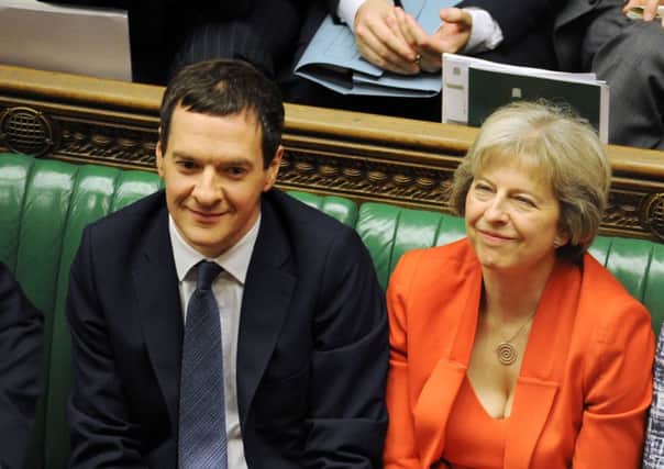Osborne alongside Theresa May, who has entered the race to be the next PM. Picture: PA