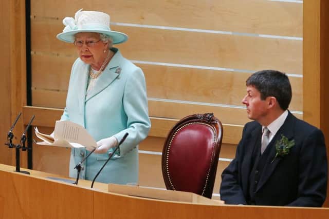 The Queen delivers her address, as Presiding Officer Ken Macintosh listens. Picture: