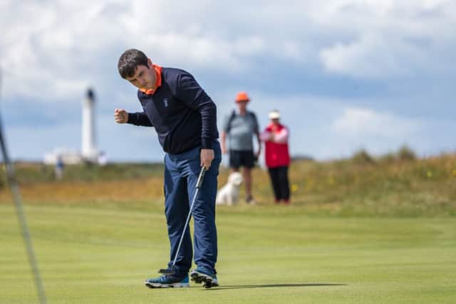 Ross Munro celebrates holing for a birdie at the par-3 15th. Picture: Kenny Smith