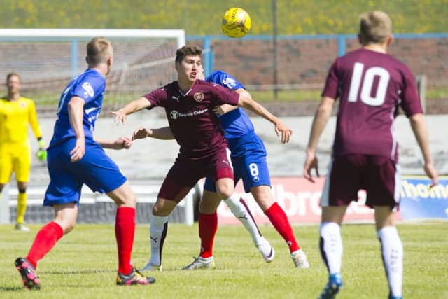 Hearts' Dario Zanatta competes against Cowdenbeath's Burton O'Brien. Picture: Ross Parker/SNS