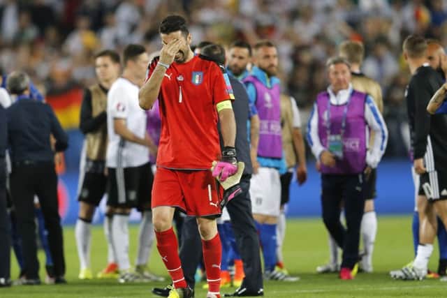 Italy goalkeeper Gianluigi Buffon leaves the pitch in tears. Picture: AP