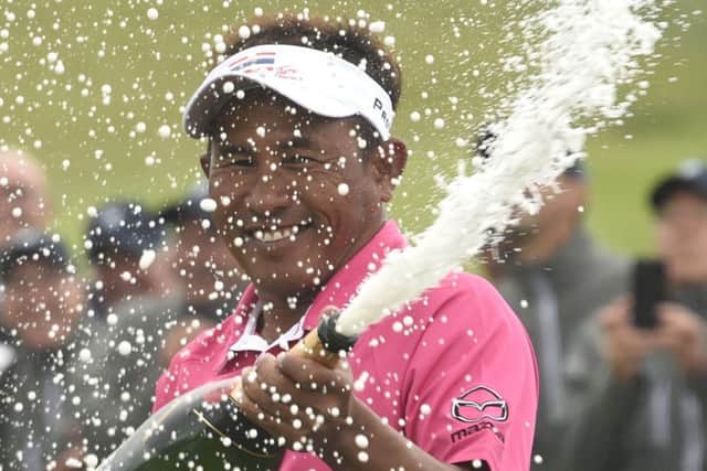 A delighted Thongchai Jaidee cracks open the bubbly after winning in Paris by four strokes. Picture: AFP/Getty Images