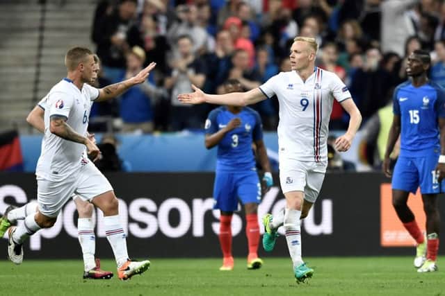 Antoine Griezmann chips over Iceland goalkeeper Hannes Halldorsson to score Frances fourth goal in the Stade de France. Picture: AFP/Getty Images