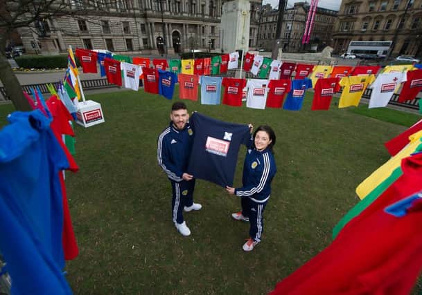 Scotland stars Robert Snodgrass and Gemma Fay help launch the Homeless World Cup, which takes place in Glasgow's George Square from July 10. Picture: John Devlin/TSPL