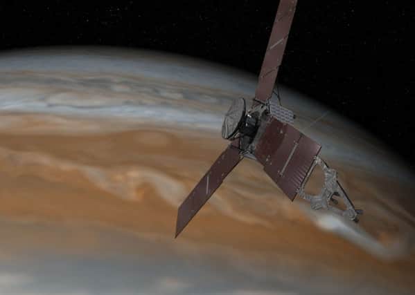 The Juno probe will orbit closer to the giant planet than any spacecraft has done before. Picture: PA