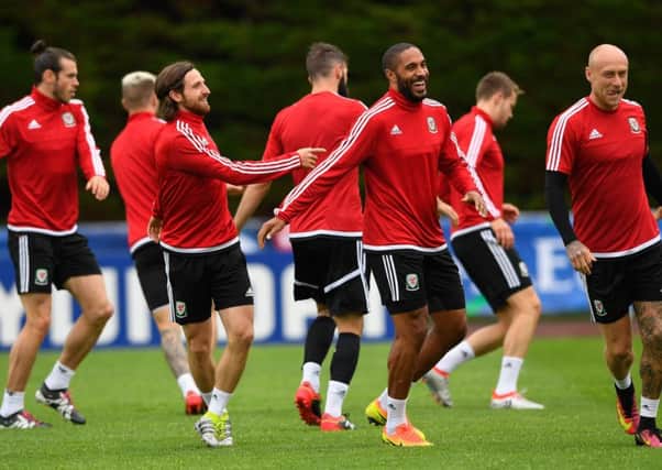 Wales captain Ashley Williams, centre, shares a joke with team-mates during training ahead of their European semi-final against Portugal. Picture:  Stu Forster/Getty Images