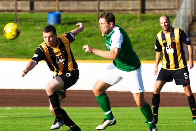 Grant Holt, centre, made his Hibs debut in the draw with Berwick Rangers. Picture: Graham Stuart/SNS