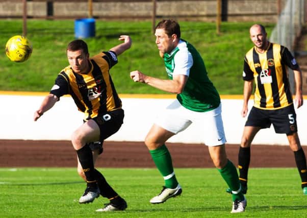 Grant Holt, centre, made his Hibs debut in the draw with Berwick Rangers. Picture: Graham Stuart/SNS