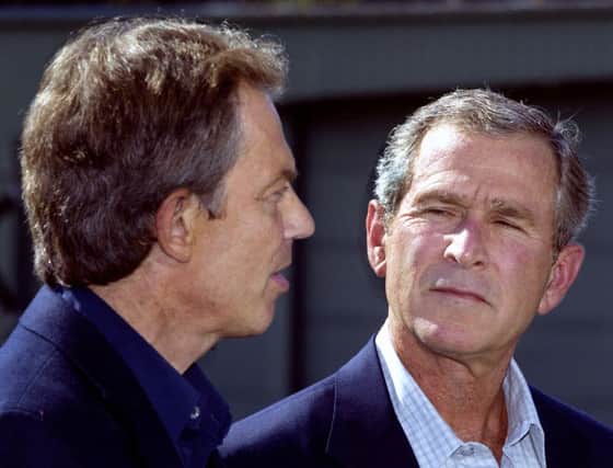 Tony Blair, left and George W Bush pictured in September 2002. Picture: AFP/Getty Images