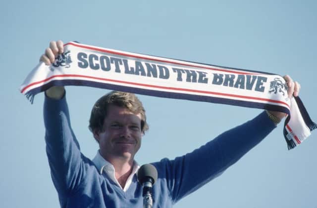 Tom Watson holds aloft a scarf after his Open win at Troon in 1982