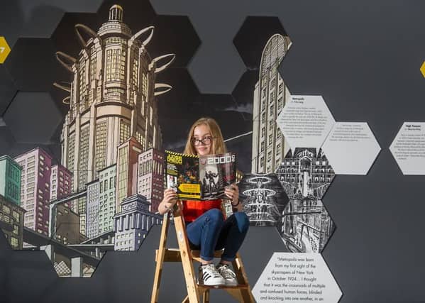 Keira Colquhoun (12) gets an early look at the exhibition, which covers all things science fiction, from Frankenstein to Flash Gordon, Star Trek to Spielberg. Picture: John Devlin
