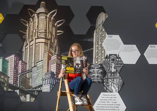 Keira Colquhoun (12) gets an early look at the exhibition, which covers all things science fiction, from Frankenstein to Flash Gordon, Star Trek to Spielberg. Picture: John Devlin