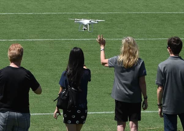 With the weather improving, drone enthusiasts are taking to the skies. Colin Houston advises always bearing your environment in mind. Picture: AFP/Getty Images