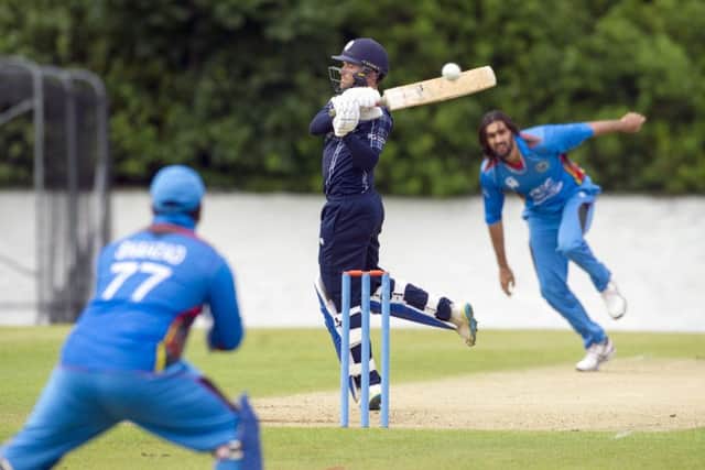 Craig Wallace fails to connect with a delivery from Shapoor Zadran at the Grange yesterday. Picture: Donald MacLeod