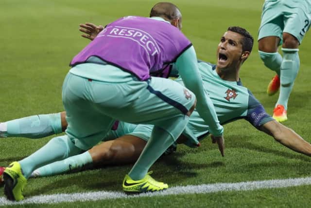 Ronaldo is jubilant after heading Portugal ahead in the 50th minute last night. Picture: Frank Augstein/AP