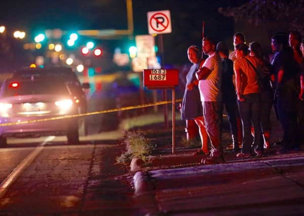 A crowd gathers at the scene of a shooting of a man involving a St Anthony Police officer on Wednesday, July 6, 2016, in Falcon Heights, Minn. Picture: AP