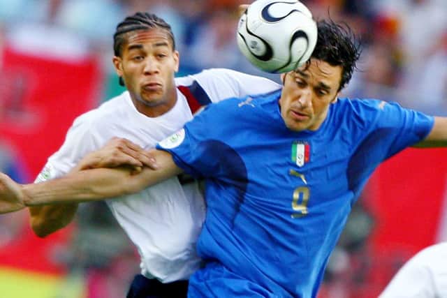 Onyewu, left, battling with Luca Toni at the 2006 World Cup. Picture: AFP/Getty