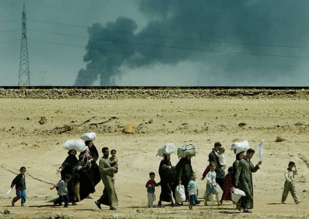 People leaving Basra in March 2003 after the coalition invasion. Credit: Dan Chung/MoD Crown Copyright/PA Wire