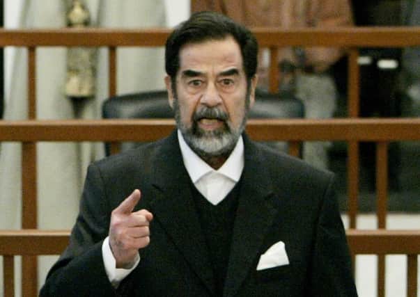 Saddam Hussein addresses the court of the Iraqi High Tribunal inside the heavily fortified Green Zone on February 14, 2006. Picture: Getty Images