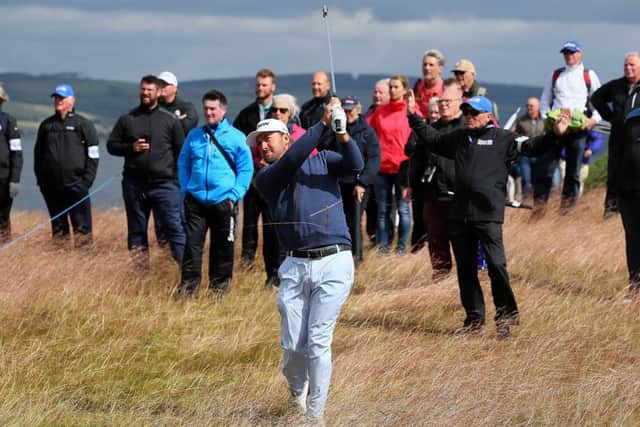 Graeme McDowell hits his second shot on the 18th during the first round of the AAM Scottish Open at Castle Stuart.  Picture: Andrew Redington/Getty Images
