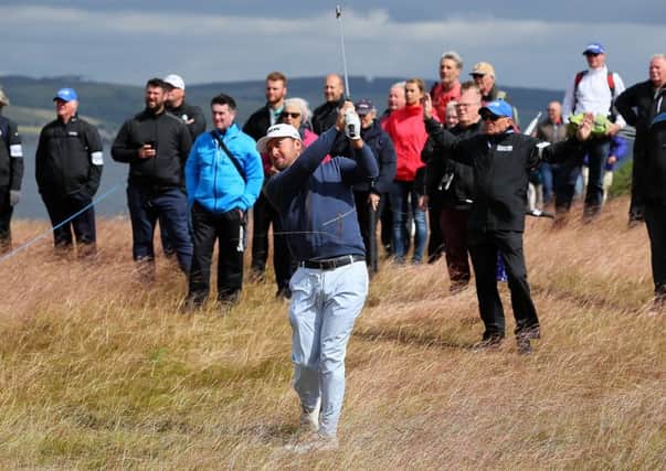 Graeme McDowell hits his second shot on the 18th during the first round of the AAM Scottish Open at Castle Stuart.  Picture: Andrew Redington/Getty Images