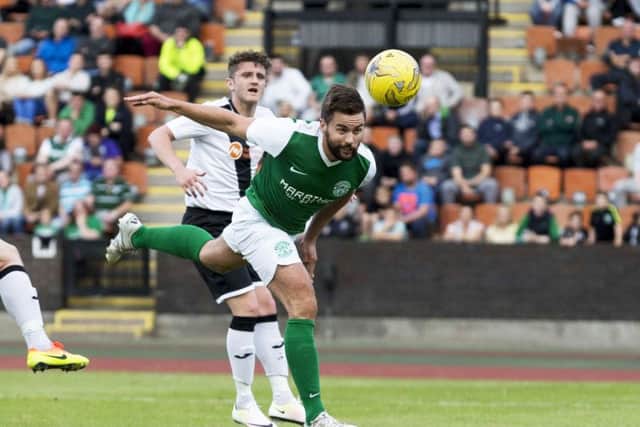 Darren McGregor scores Hibs' openening goal. Picture: SNS