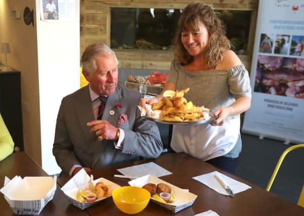 The Prince of Wales at a fish and chip shop in the village of Aberdaron in Wales. The prince has applied to set up a restaurant in Ballater. Picture: PA