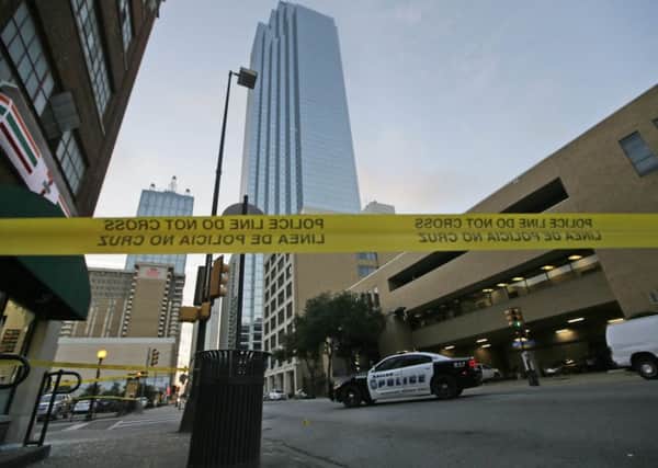 Police tape marks off the area where a shooting took place in downtown Dallas, Friday. Picture: AP