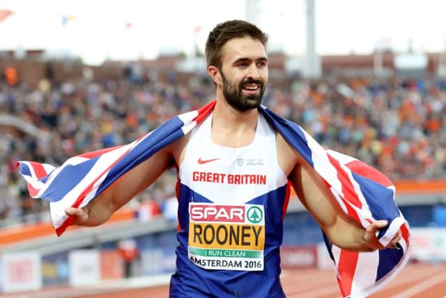 Great Britain's Martyn Rooney celebrates winning the men's 400m final at the European Championships in Amsterdam. Photograph: Martin Rickett/PA