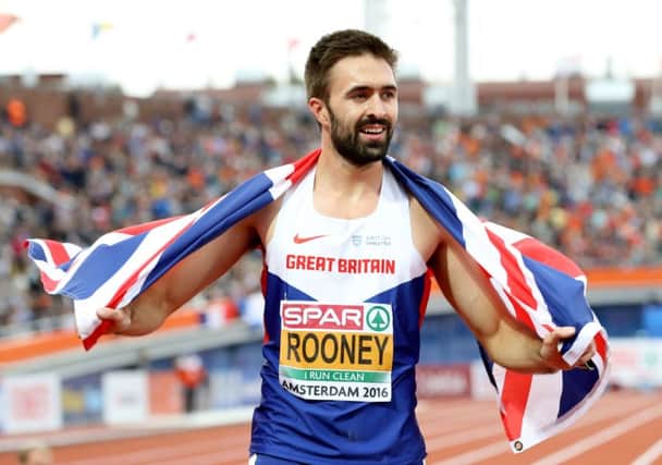 Great Britain's Martyn Rooney celebrates winning the men's 400m final at the European Championships in Amsterdam. Photograph: Martin Rickett/PA
