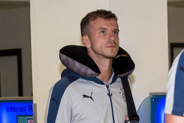 Rangers' Andy Halliday arrives back from South Carolina, USA this morning. Picture: SNS