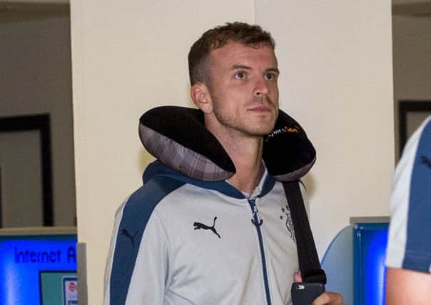 Rangers' Andy Halliday arrives back from South Carolina, USA this morning. Picture: SNS