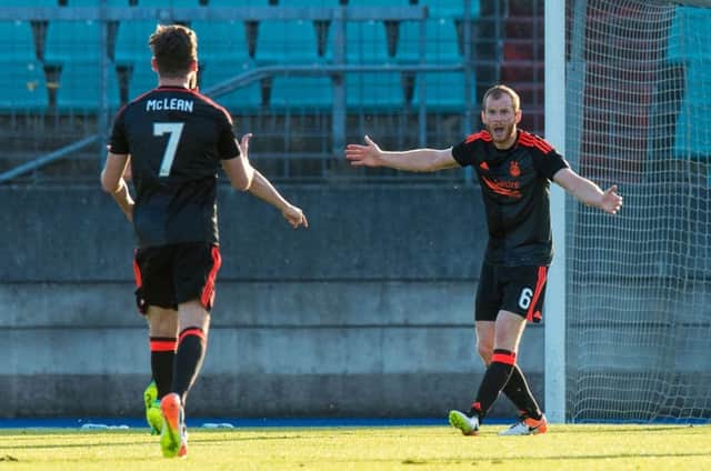 Aberdeen's Mark Reynolds in action against Fola Esch