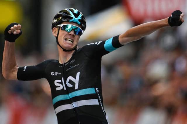 Chris Froome crosses the line to win the eighth stage of the Tour de France. Picture: Lionel Bonaventure/AFP/Getty.