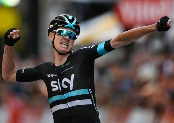 Chris Froome crosses the line to win the eighth stage of the Tour de France. Picture: Lionel Bonaventure/AFP/Getty.