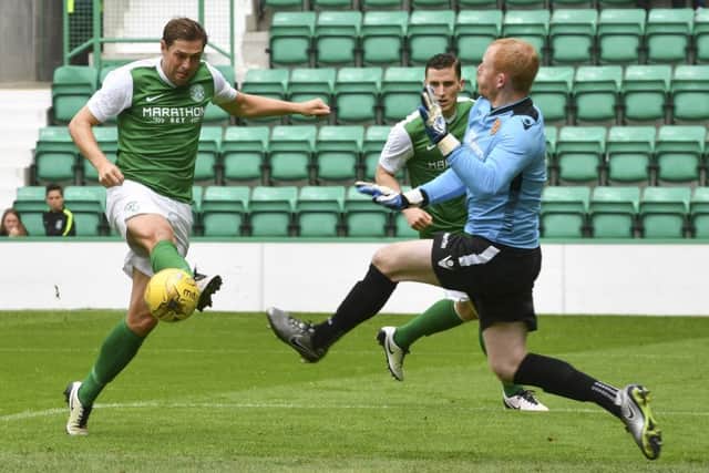 Hibernian striker Grant Holt nets his sides second goal of the afternoon at Easter Road. Picture: SNS