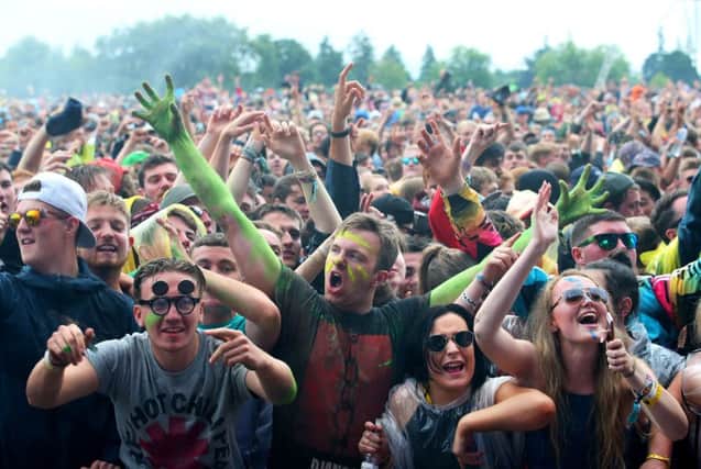 Crowds braved the weather to enjoy themselves on the final day of the 2016 festival. Picture: PA/Jane Barlow