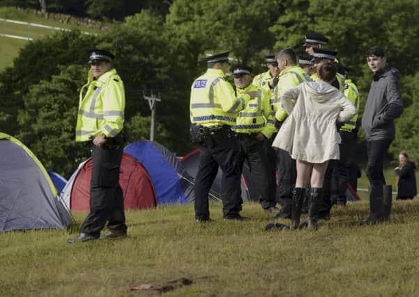 Police at a campsite at Scotland's T in the Park music festival at Strathallan Castle in Perthshire.