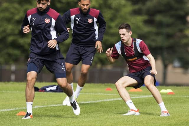 Hearts captain Alim Ozturk, left, leads Faycal Rherras,centre, and Liam Smith in training ahead of tomorrow's clash with Birkirkara. Picture: Alan Rennie/SNS Group