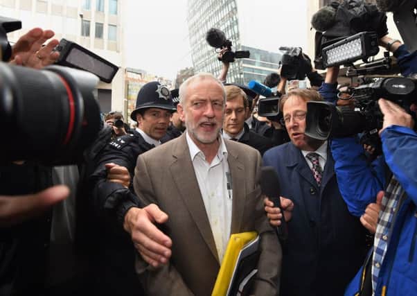 Jeremy Corbyn was mobbed by reporters as he arrived at Labour HQ in Westminster for the partys NEC meeting. Picture: PA