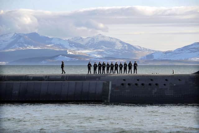 British Navy personnel stand atop the Trident Nuclear Submarine, HMS Victorious. Picture: Andy Buchanan/AFP/Getty Images