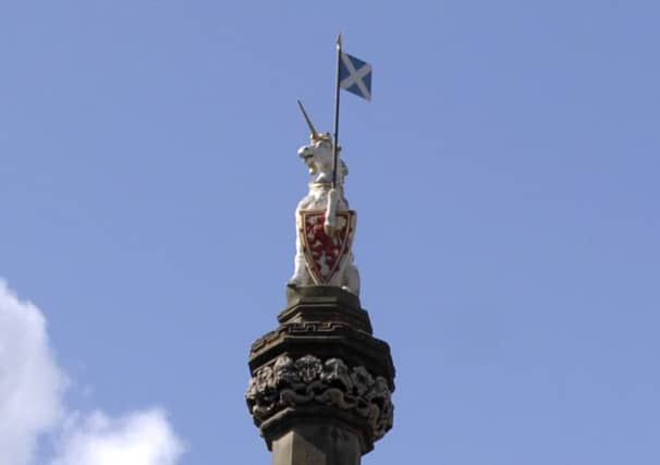The unicorn finial on the mercat cross in Edinburgh's High Street. Picture: Greg Macvean