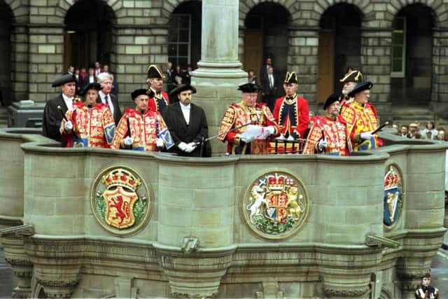 The Lord Lyon, Sir Malcolm Innes, issues the Royal Proclamation on the Dissolving of Parliament from the Mercat Cross in Edinburgh, March 1992. Picture: Denis Straughan