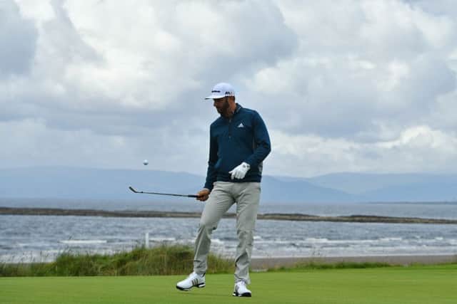 Dustin Johnson taps a ball in the air with his club during practice ahead of the Open at Royal Troon. Picture: Stuart Franklin/Getty Images