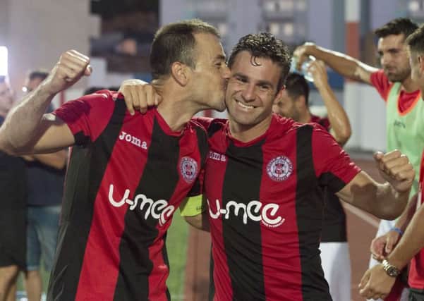 Lincoln Red Imps' Lee Casciaro (right) and Roy Chipolina celebrate their shock win at full time. Picture: SNS